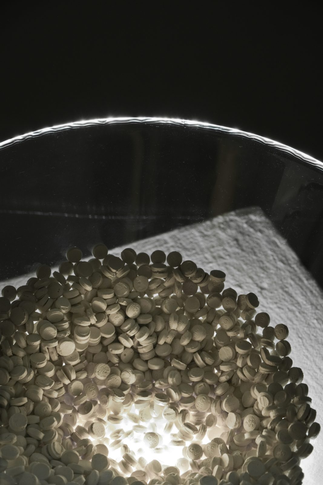 Close-up of the cast pills lit from below