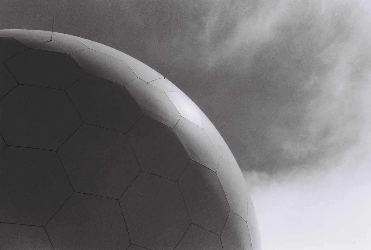 Black-and-white dome against a cloudy sky