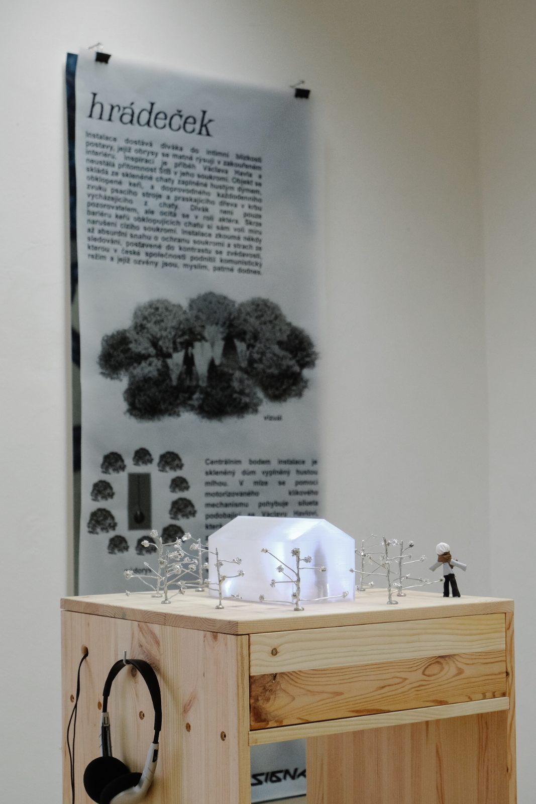White architectural model on a wooden box