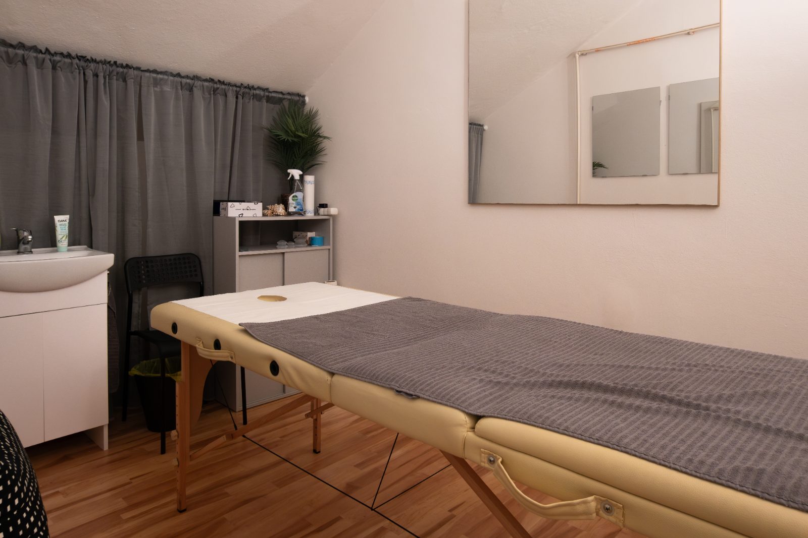 Massage room with a treatment table