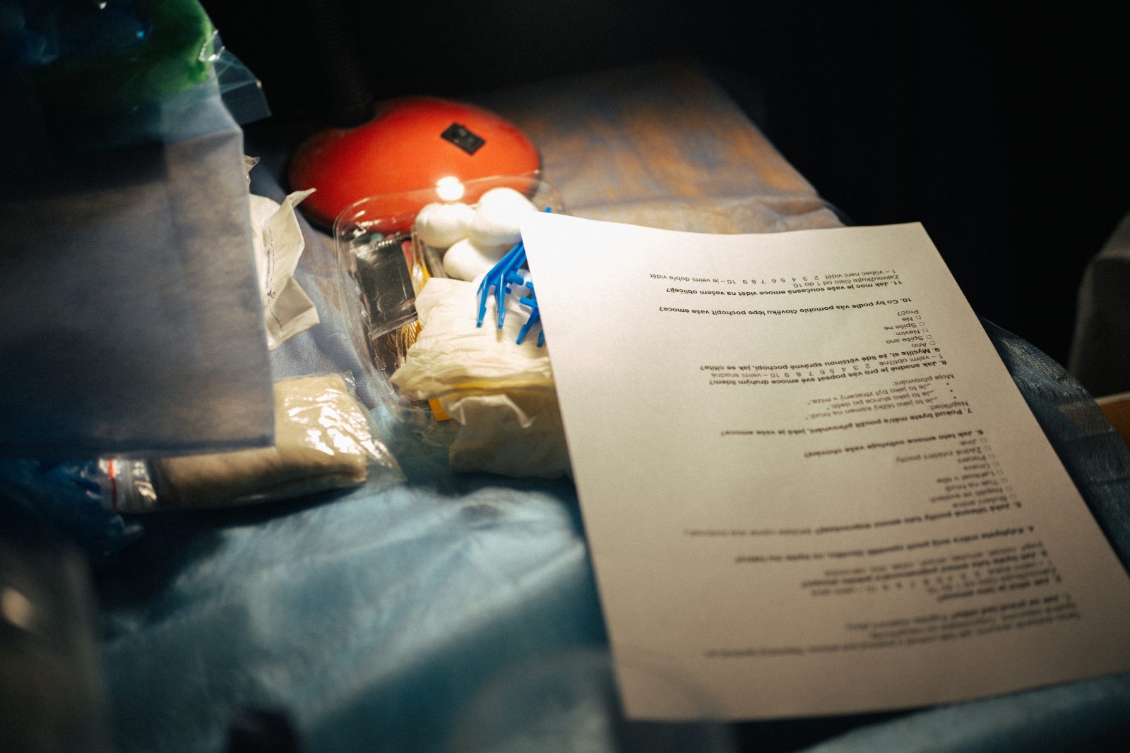 A lamp and a printed document in a dark room