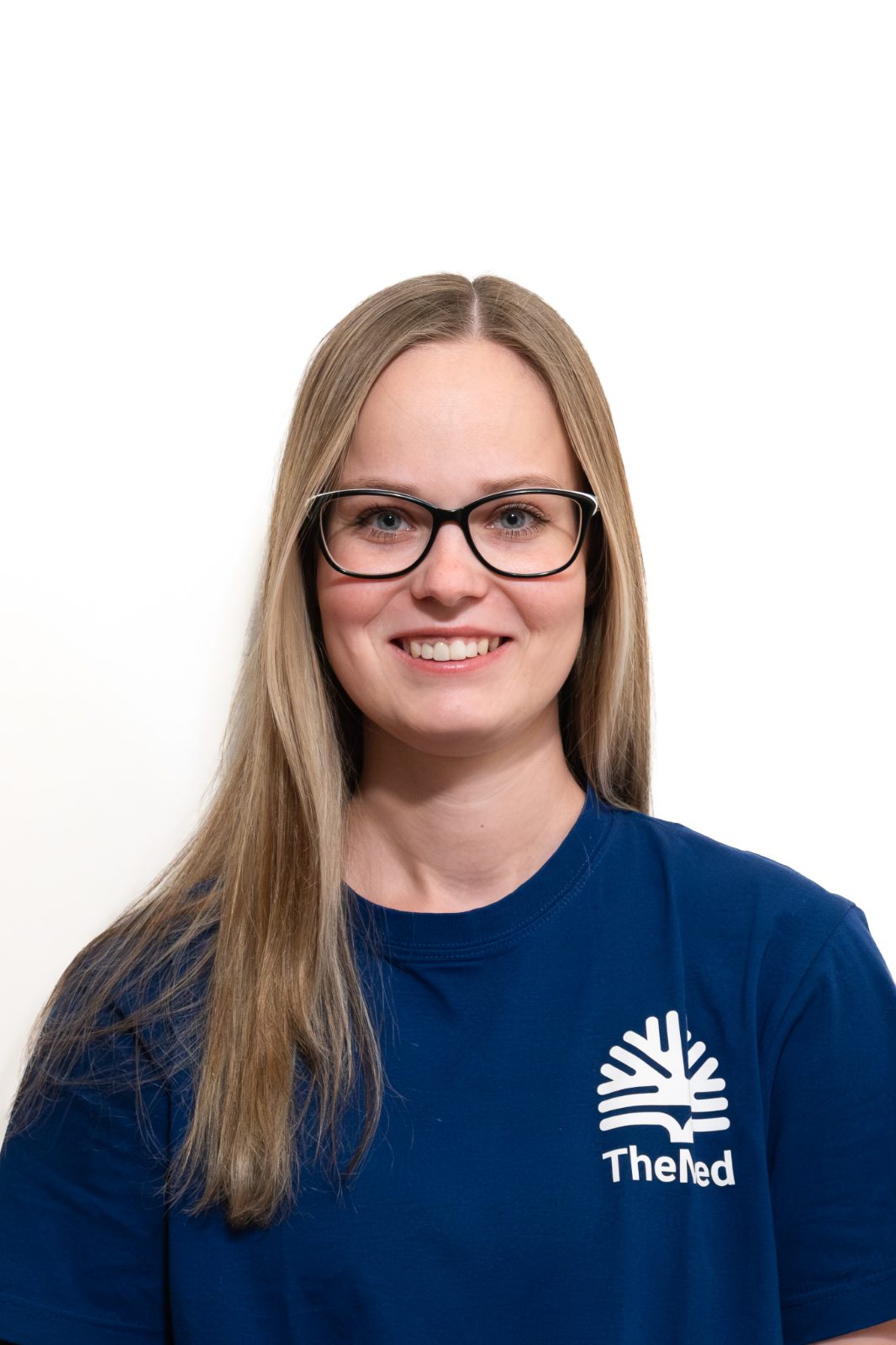 Portrait of a female therapist in a TheMed T-shirt
