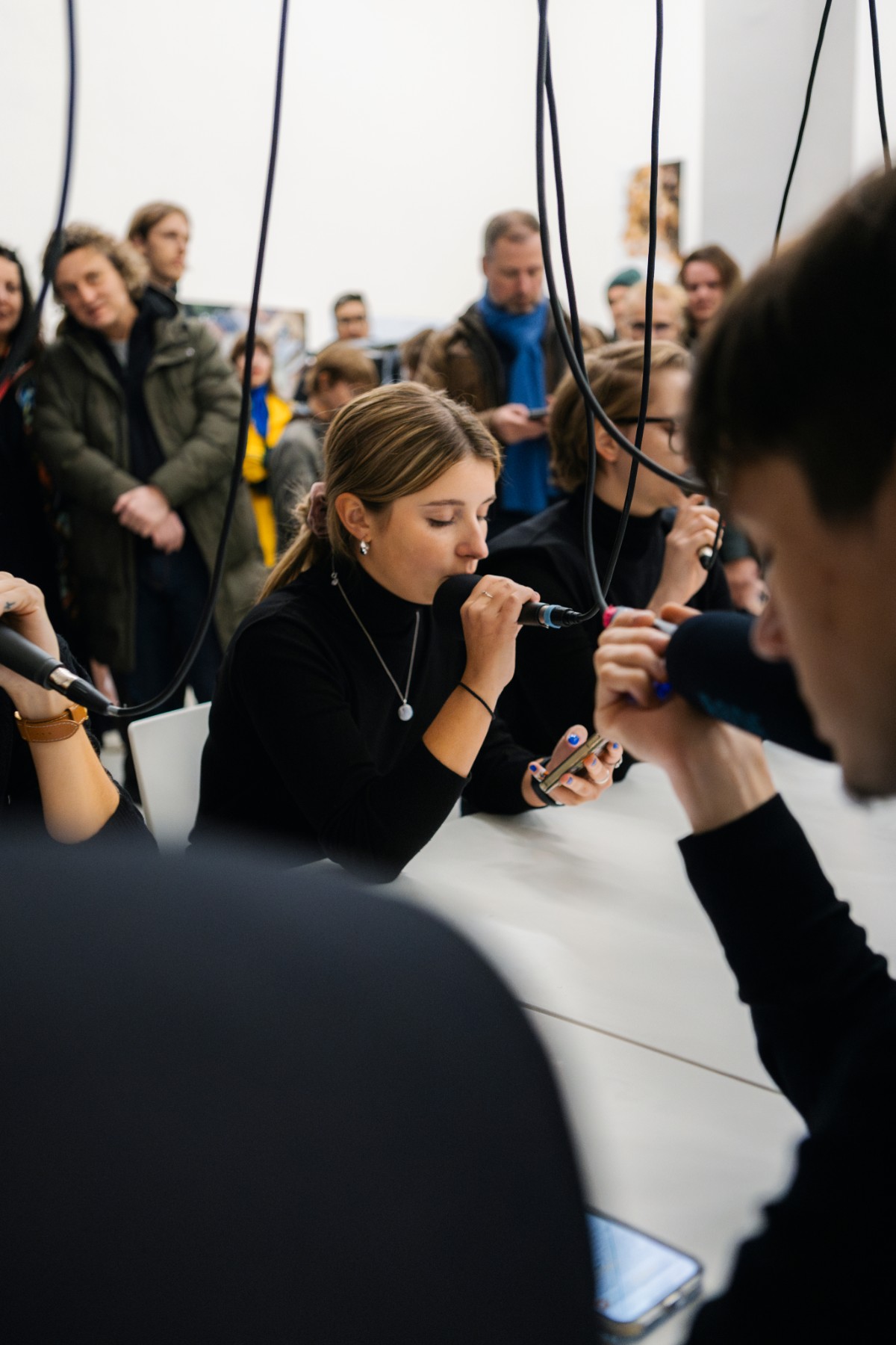 Performance with microphones in a crowded gallery